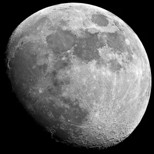 A black and white glass wall print showing a close up of the moon