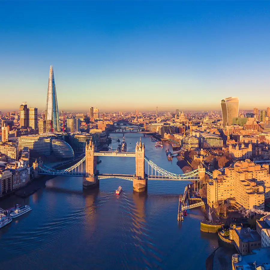 132796360-london-river-thames-fi panoramic glass wall art of golden hour in London, with the iconic Tower Bridge