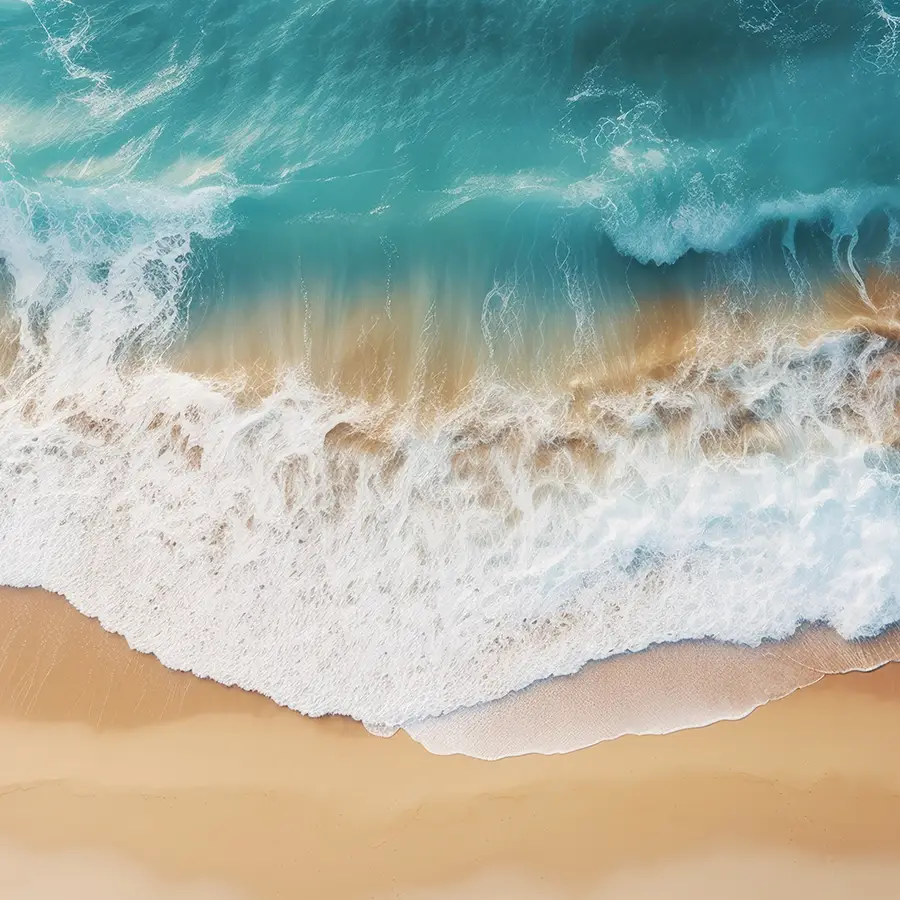 706665033-fresh-ocean-waves-over-sand-fi A glass wall art showing vibrant blue waves crashing onto the beach